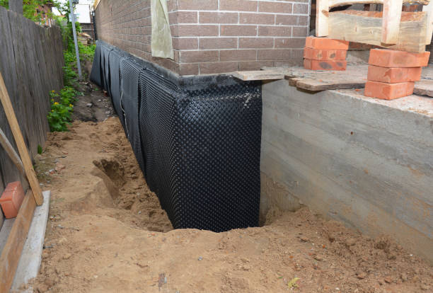 Happy homeowners after waterproofing job in Rosebush